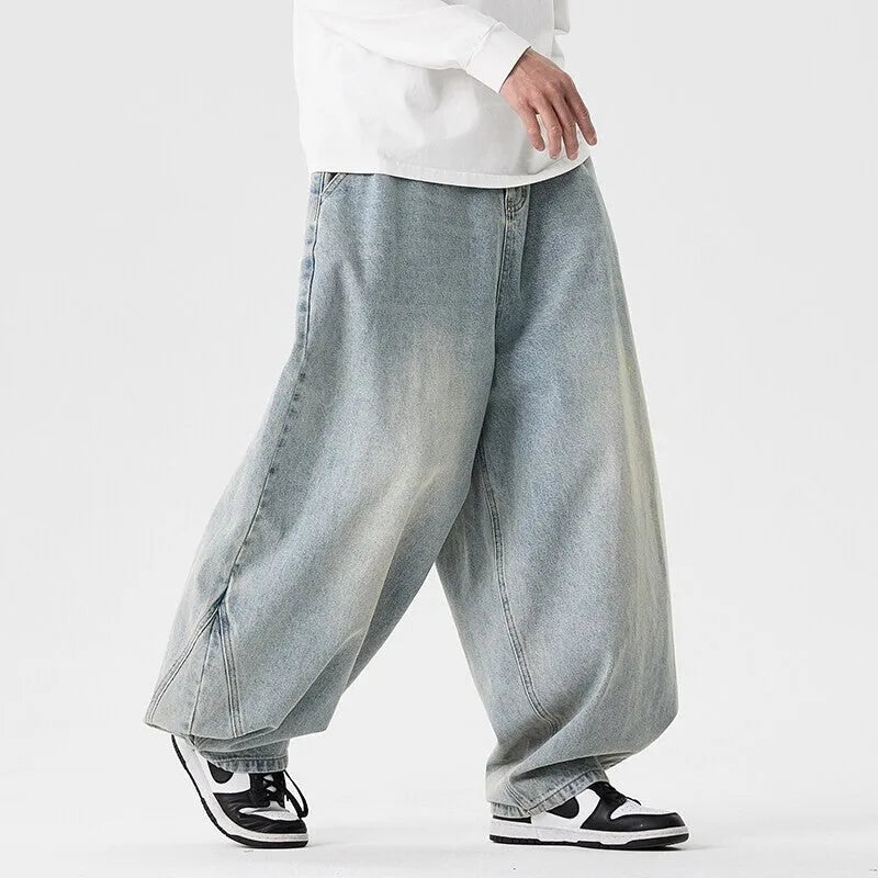 Men's plus-size light blue baggy jeans with a straight leg and zip fly