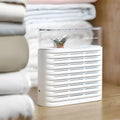 White recyclable cabinet dehumidification box with transparent top showing colour-changing silica gel beads