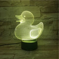 Little yellow duck 3D night light with multi-colour LED glow on an ABS base, showing remote control.