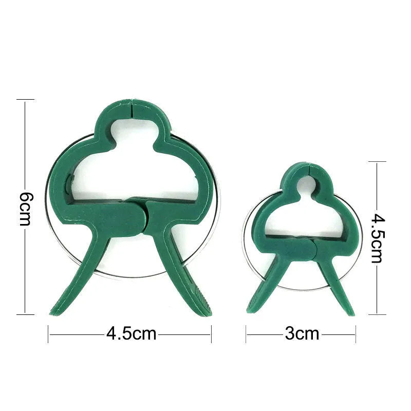 Green plastic and zinc plant fixing clips, large and small sizes, for training climbing vines and tomatoes.