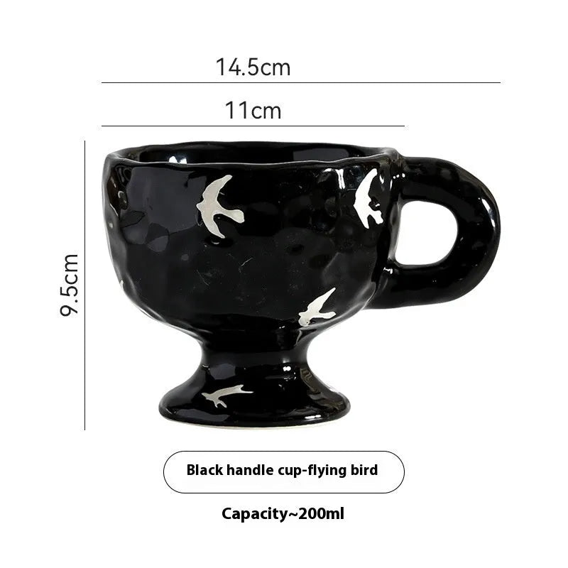 Hand-pinched irregular ceramic mug with modern minimalist design in solid colour