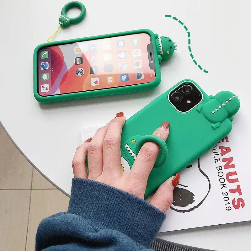 Green silicone phone case with a cartoon animal design for Apple iPhone models.