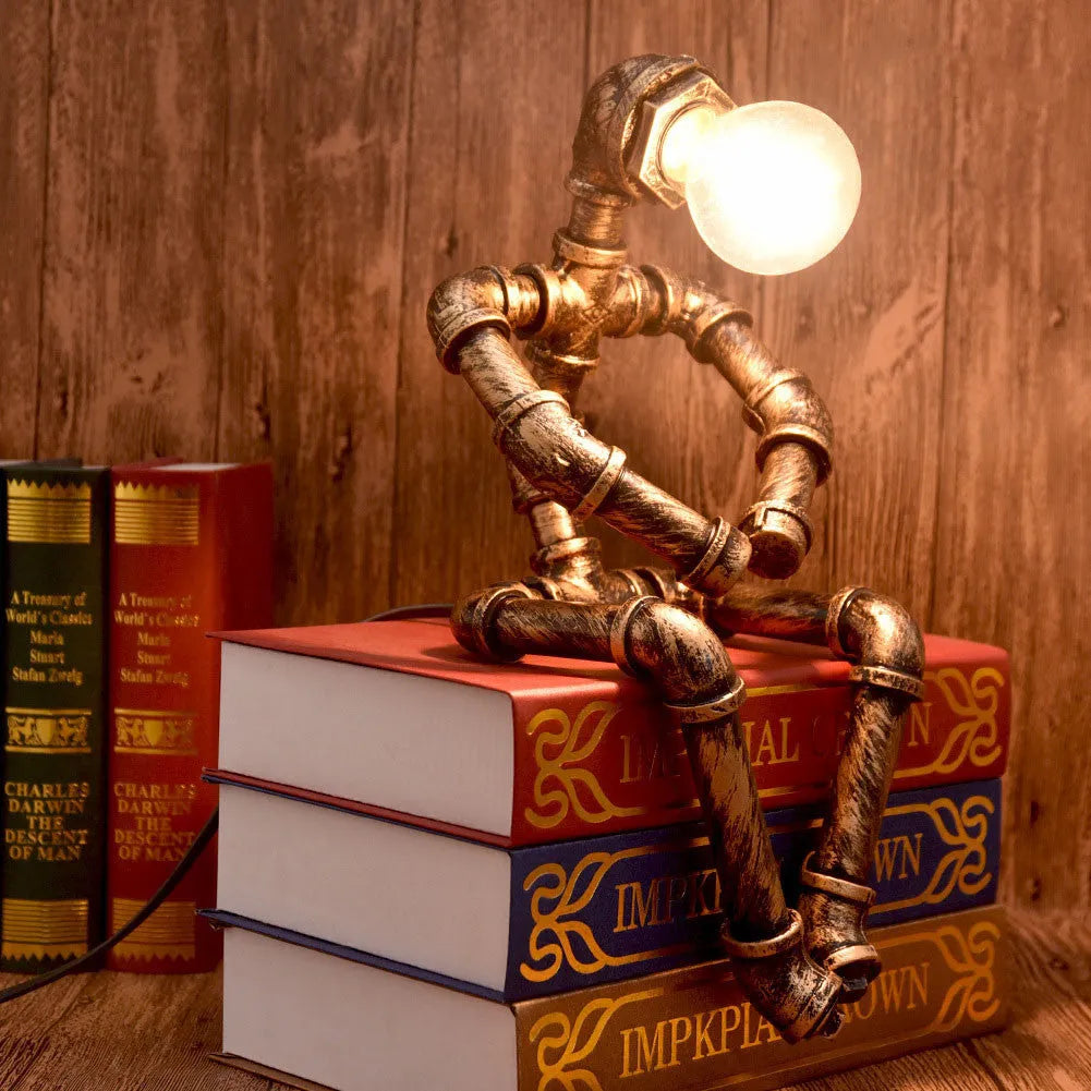 Robot vintage industrial table lamp with iron pipe construction in green bronze finish
