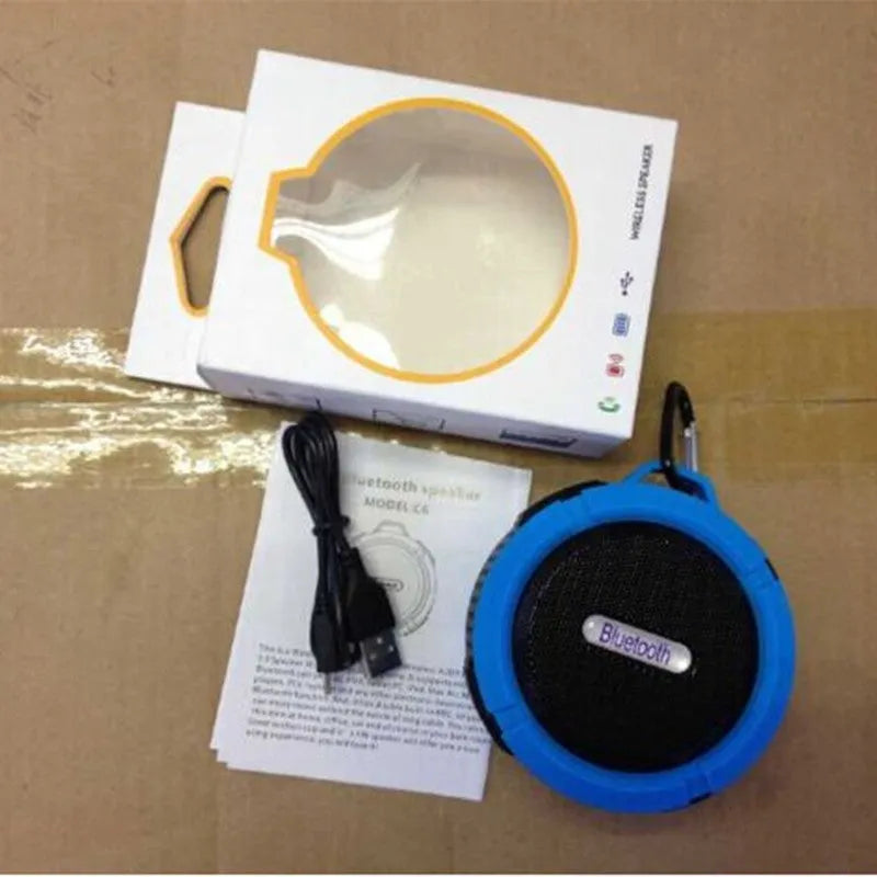Waterproof portable Bluetooth speaker in multiple colours with mountaineering buckle attachment