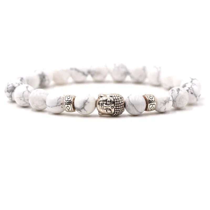Tigereye stone Buddha head stretch bracelet with 8mm beads on a wrist.