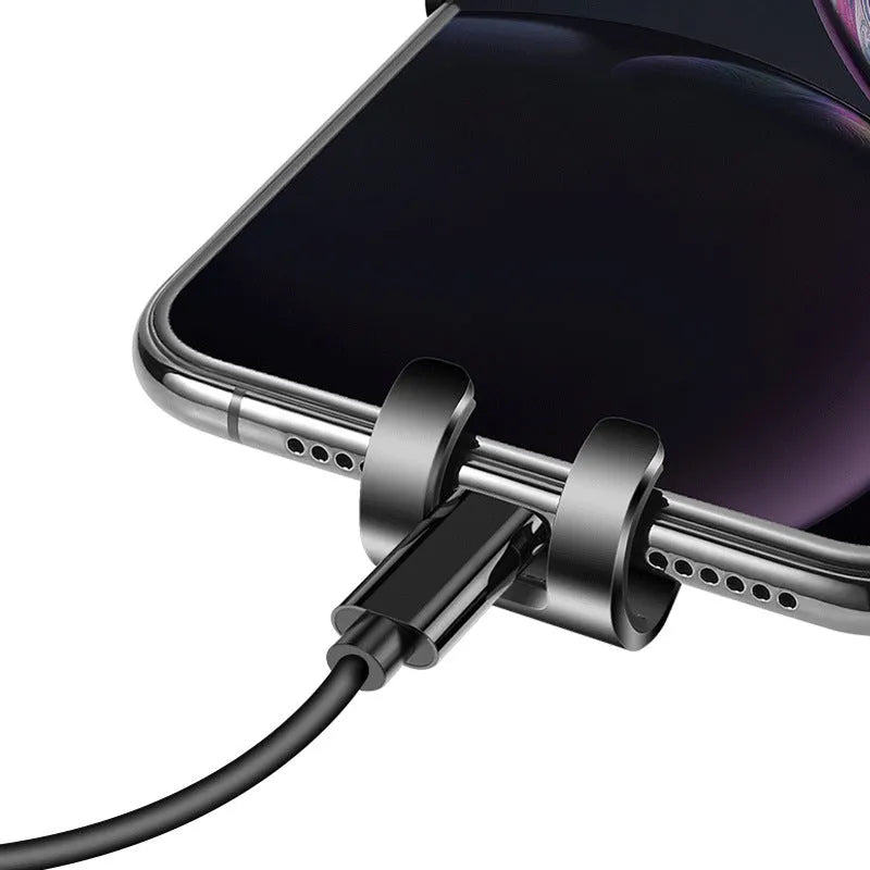 Black ABS gravity mirror car phone holder attached to a vehicle air vent.