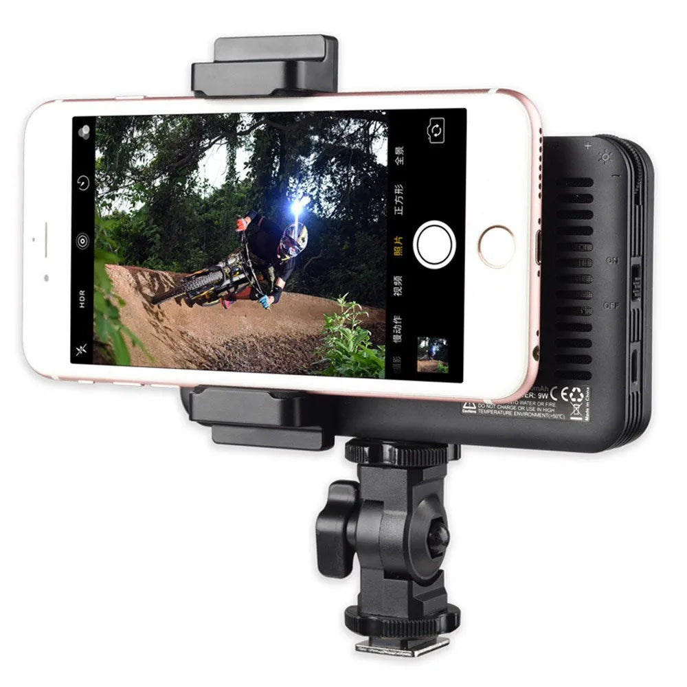 Shenniu M150 ultra-thin LED video light mounted on a mobile phone showing its slim profile.
