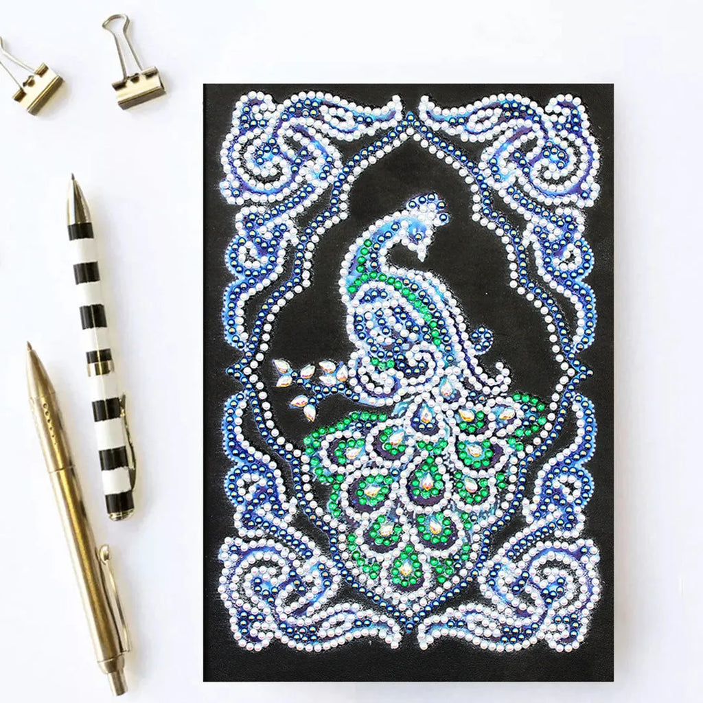 Black A5 diamond painting notebook with peacock design showing shaped and bright drills