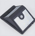 Four solar-powered LED motion sensor lights for outdoor garden and wall mounting