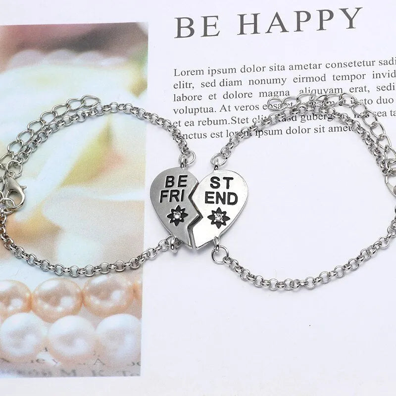 Heart shape alloy bracelet with dripping oil finish and inlaid gems in gold and silver colours