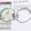 Heart shape alloy bracelet with dripping oil finish and inlaid gems in gold and silver colours