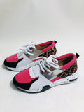 Women's black suede casual sneakers with a wedge heel on a white background
