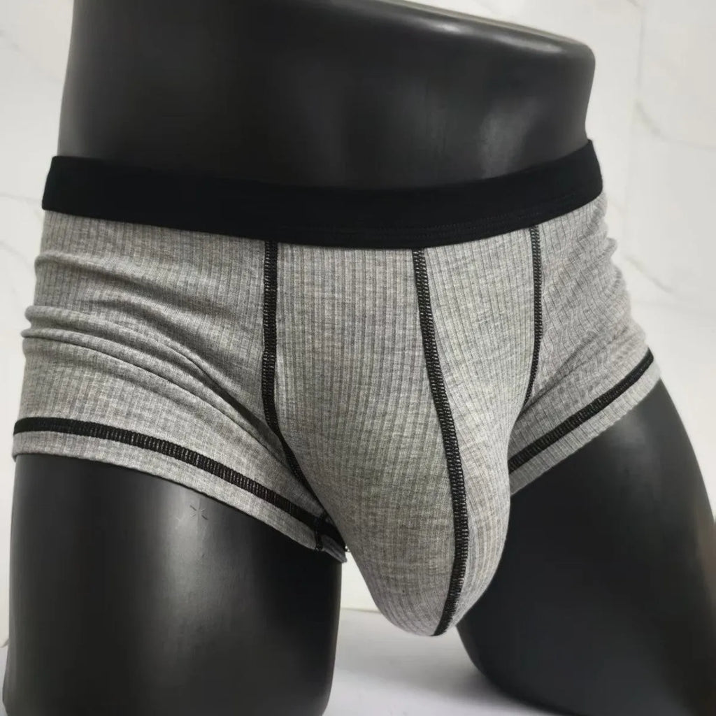 Men's slim-fit breathable boxer shorts in solid colours, shown in size range L to 3XL.