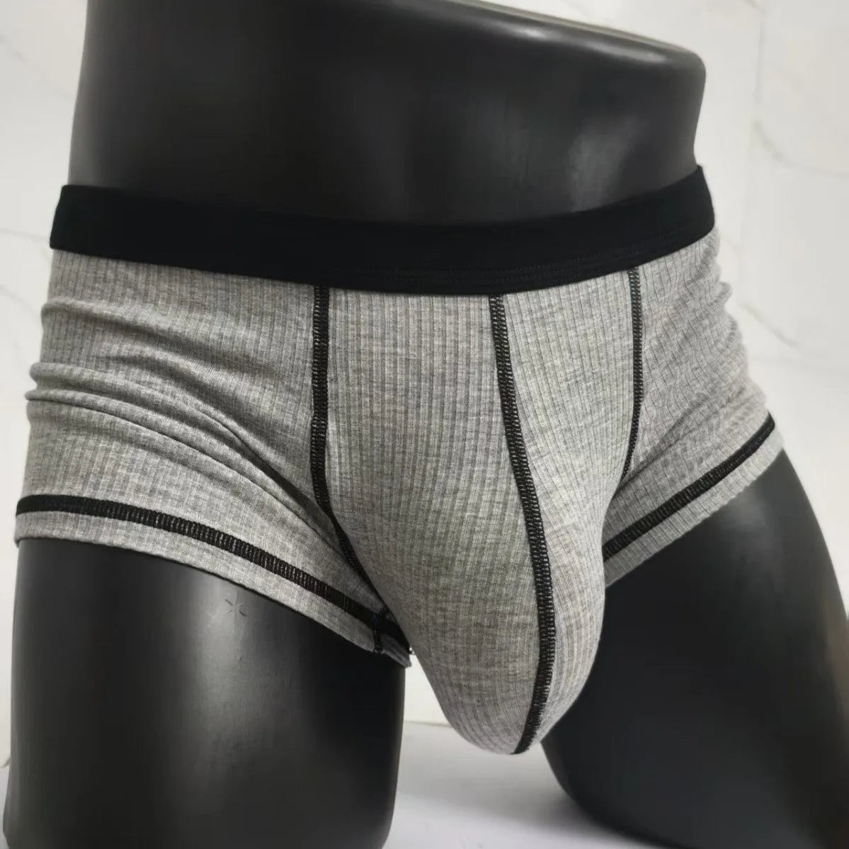 Men's slim-fit breathable boxer shorts in solid colours, shown in size range L to 3XL.
