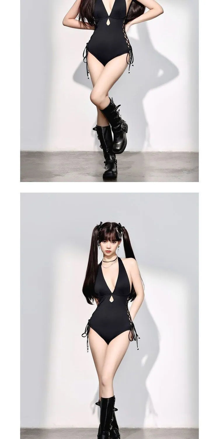 Women's V-neck hollow strap one-piece swimsuit in black, front view, shown on a model