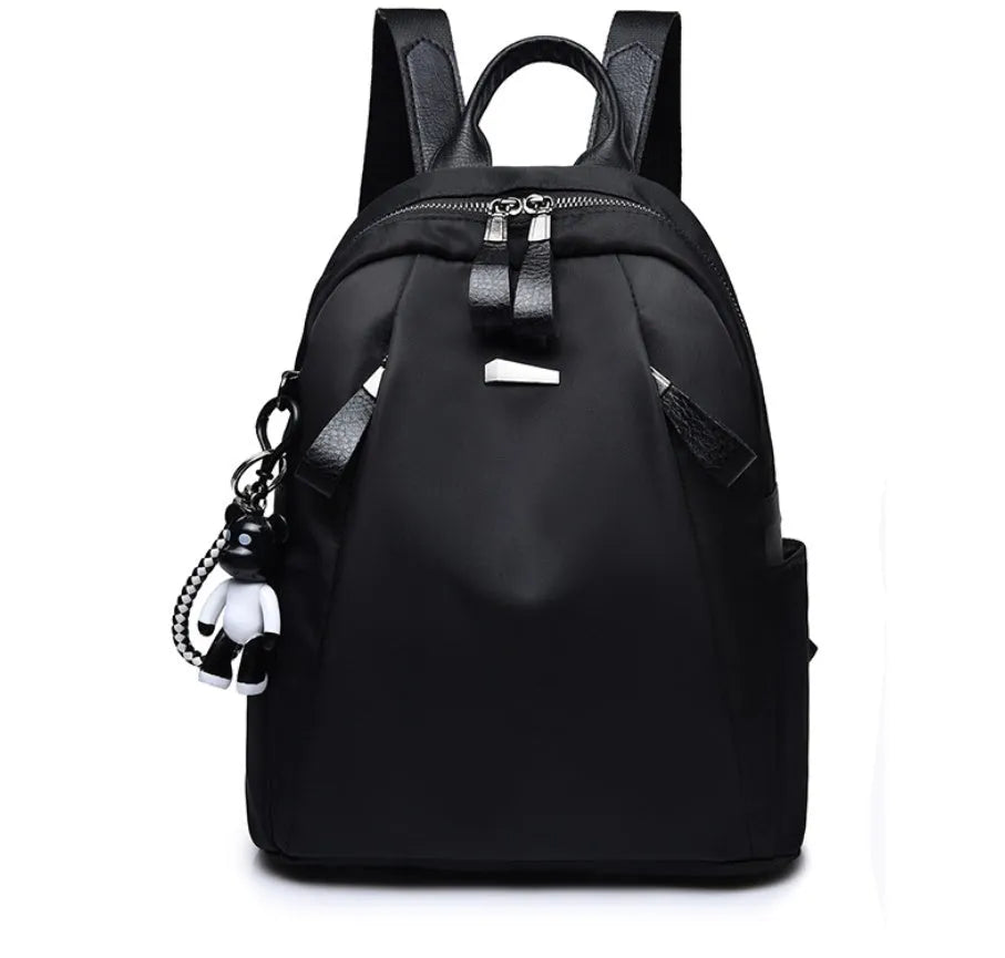 Medium square Oxford cloth rucksack in black with double straps and a front digging bag.