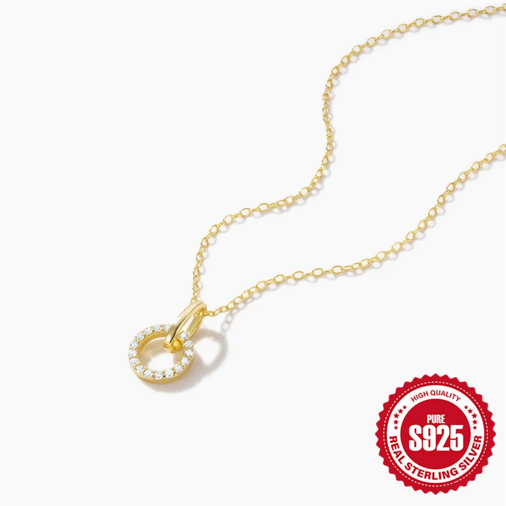 Gold-colour sterling silver necklace with geometric zircon pendant on an adjustable clavicle chain.