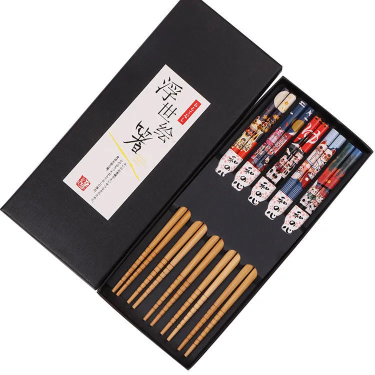 Set of five pairs of bamboo chopsticks with colourful Japanese lucky cat pattern design.