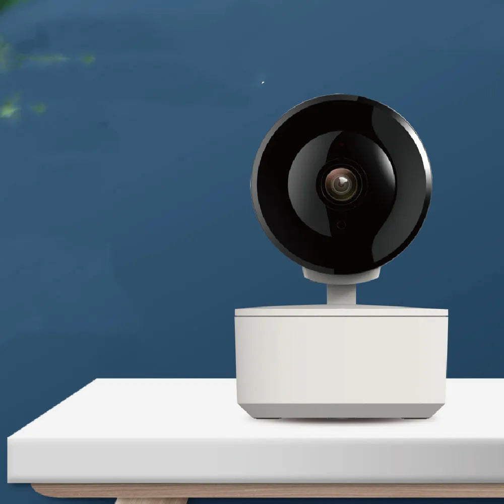 Smart WiFi security camera with PTZ rotation on desktop with mobile app display
