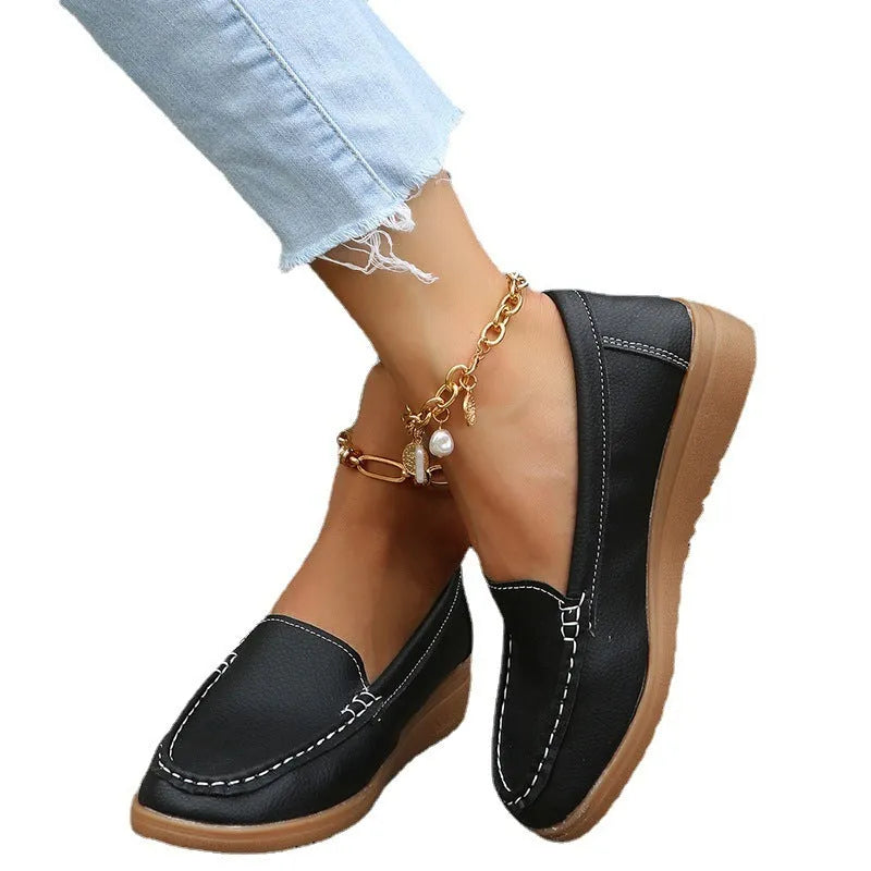 Women's flat loafer shoes in PU leather, showing round toe and car suture detail, on a rubber sole.