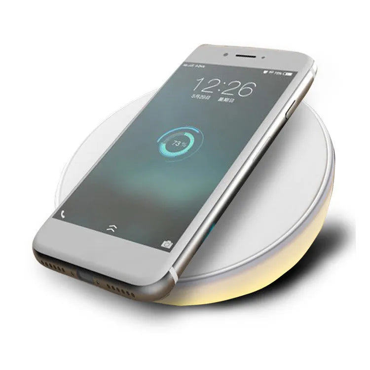 White wireless phone charger with LED clock display showing time, 115mm wide with three control buttons