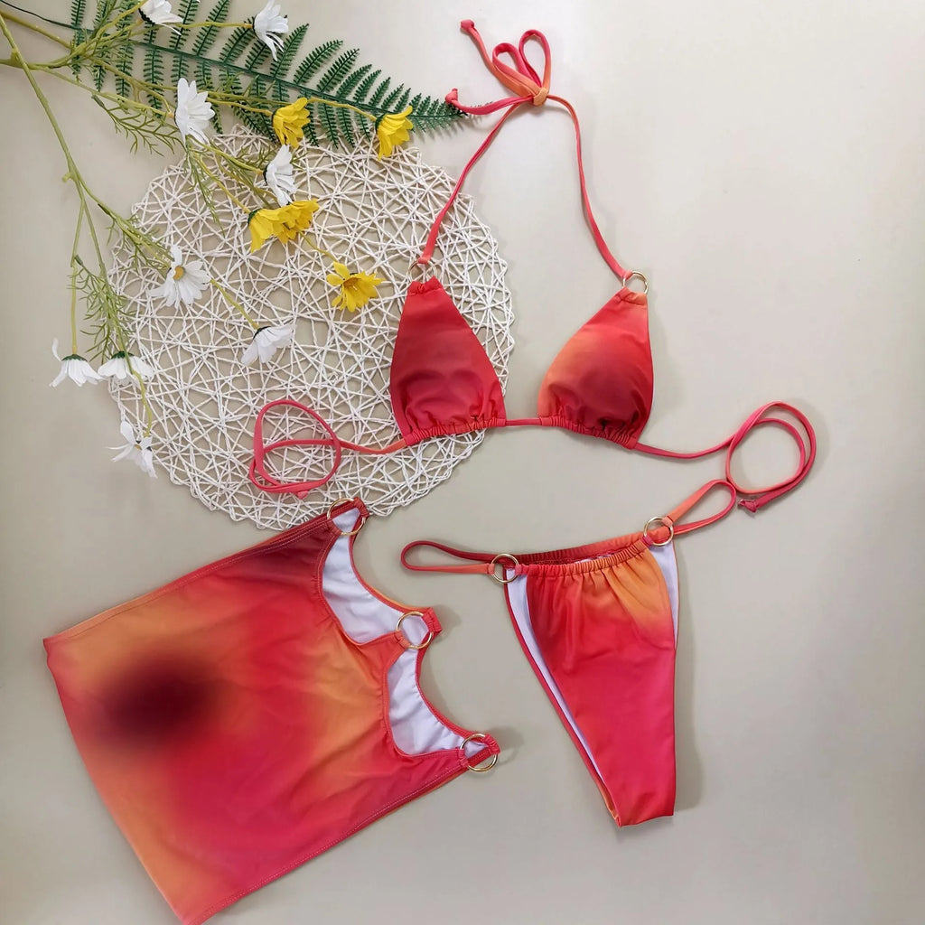 Solid colour tie-dye halter top three-piece bikini set with skirt on a mannequin.