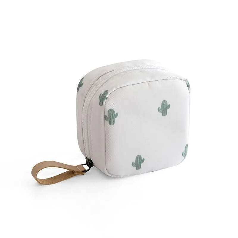 A cube-shaped cloth makeup storage bag available in blue, pink, white, and white pink colours.