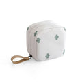 A cube-shaped cloth makeup storage bag available in blue, pink, white, and white pink colours.