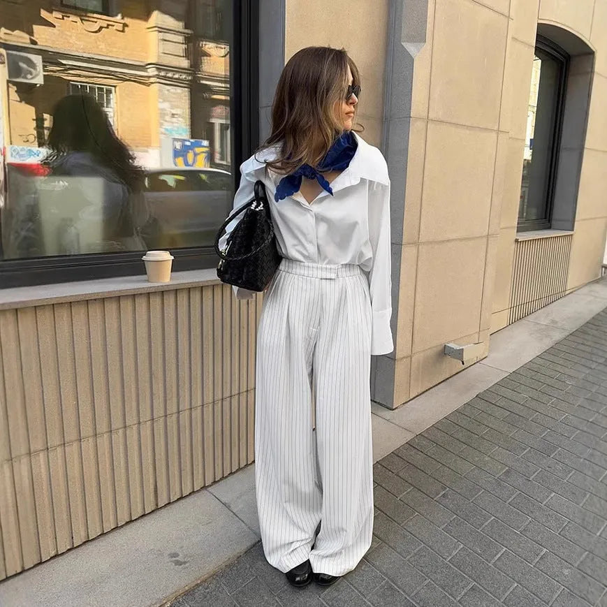 White striped wide-leg women's trousers with zipper, loose fit for commuting.