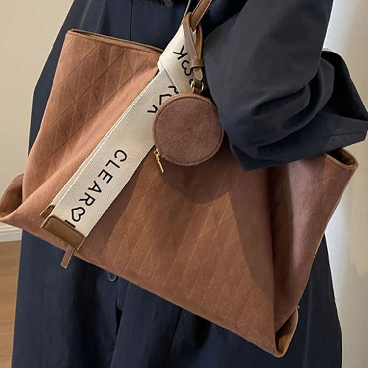 Soft polyester large tote shoulder bag in a horizontal square shape with an external pocket.