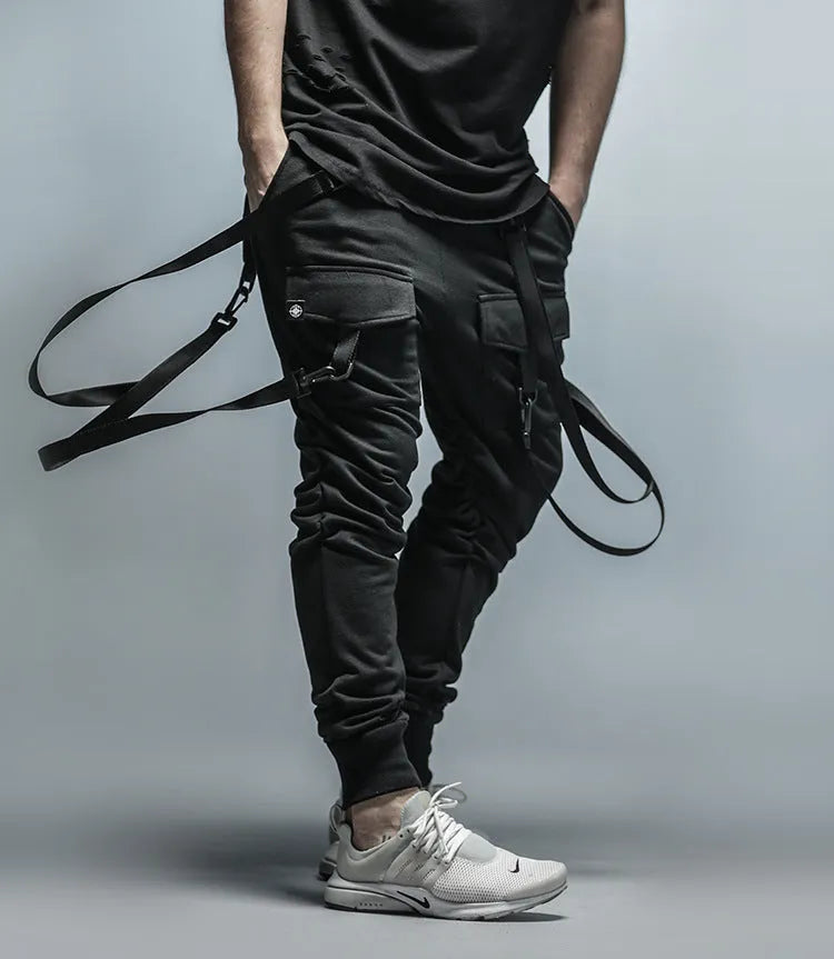 Men's black cotton blend pencil sweatpants with belt, flat lay showing tapered leg and waist elastic