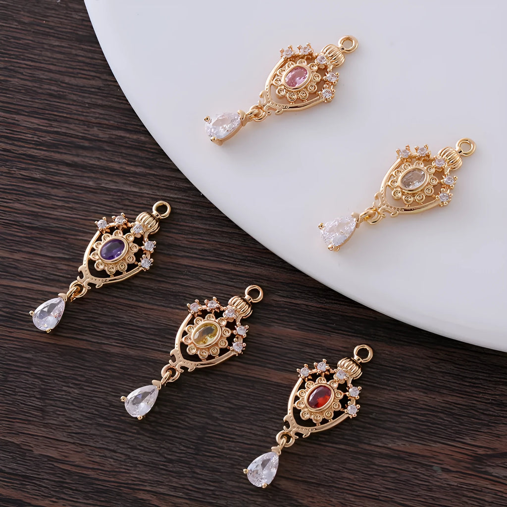 Water drop shaped pendant with crown design and micro inlaid zircon detail in electroplated copper.