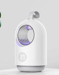 White indoor mosquito killer lamp with blue UV light and a top carry handle on a table