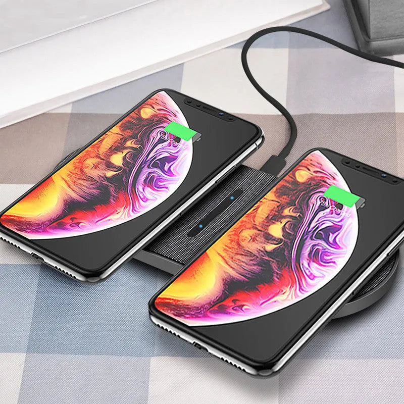 Black dual wireless charging station showing two smartphone charging pads with indicator lights