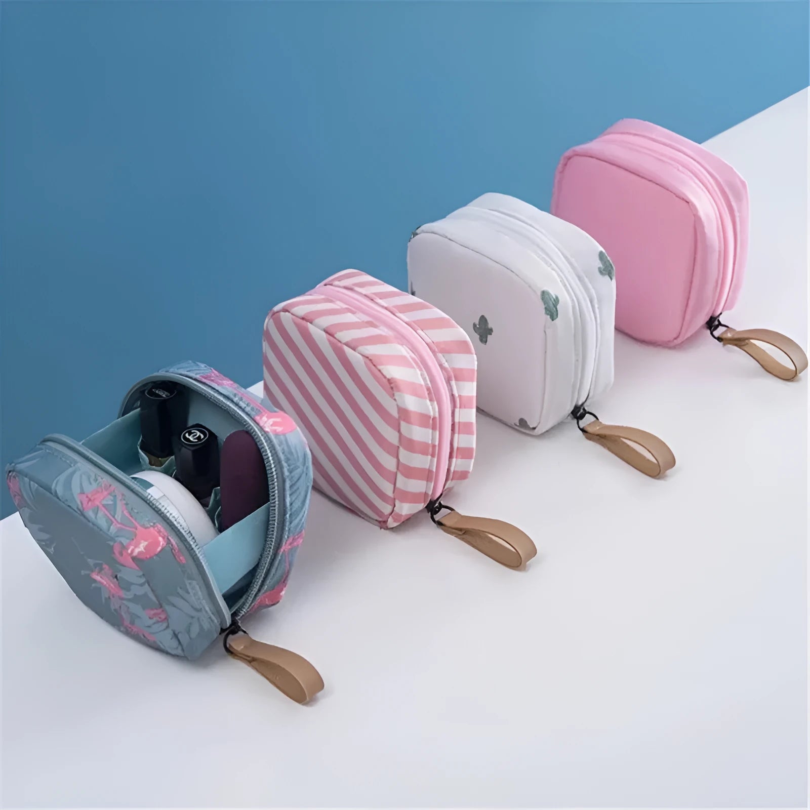 A cube-shaped cloth makeup storage bag available in blue, pink, white, and white pink colours.
