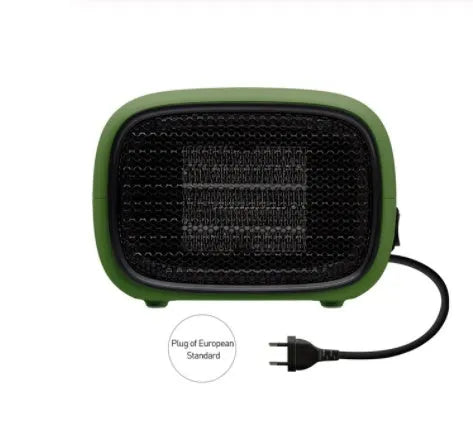 Green, white and yellow mini personal space heater on a desk showing compact size.