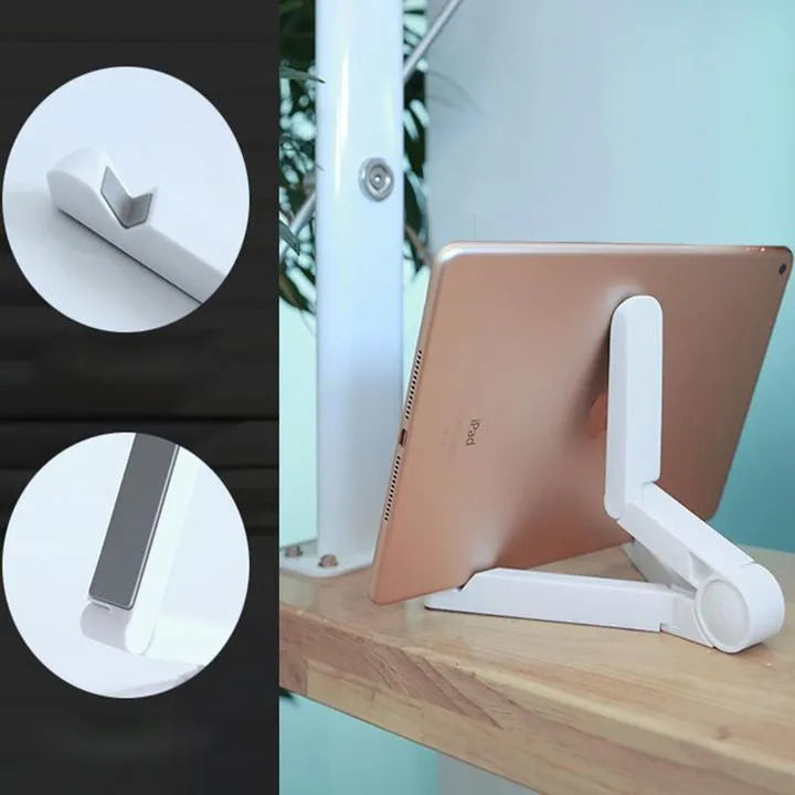 Black foldable tablet holder standing upright with a tablet device resting on its non-slip rubber surface.