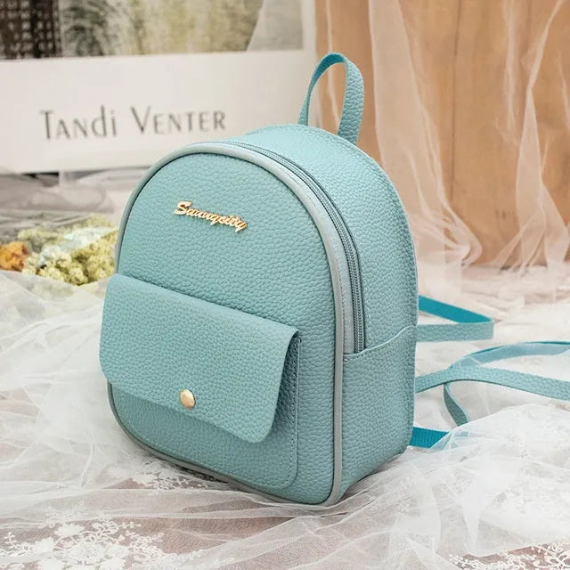 Solid colour PU leather women's small shoulder backpack with zipper, shown in available colours.