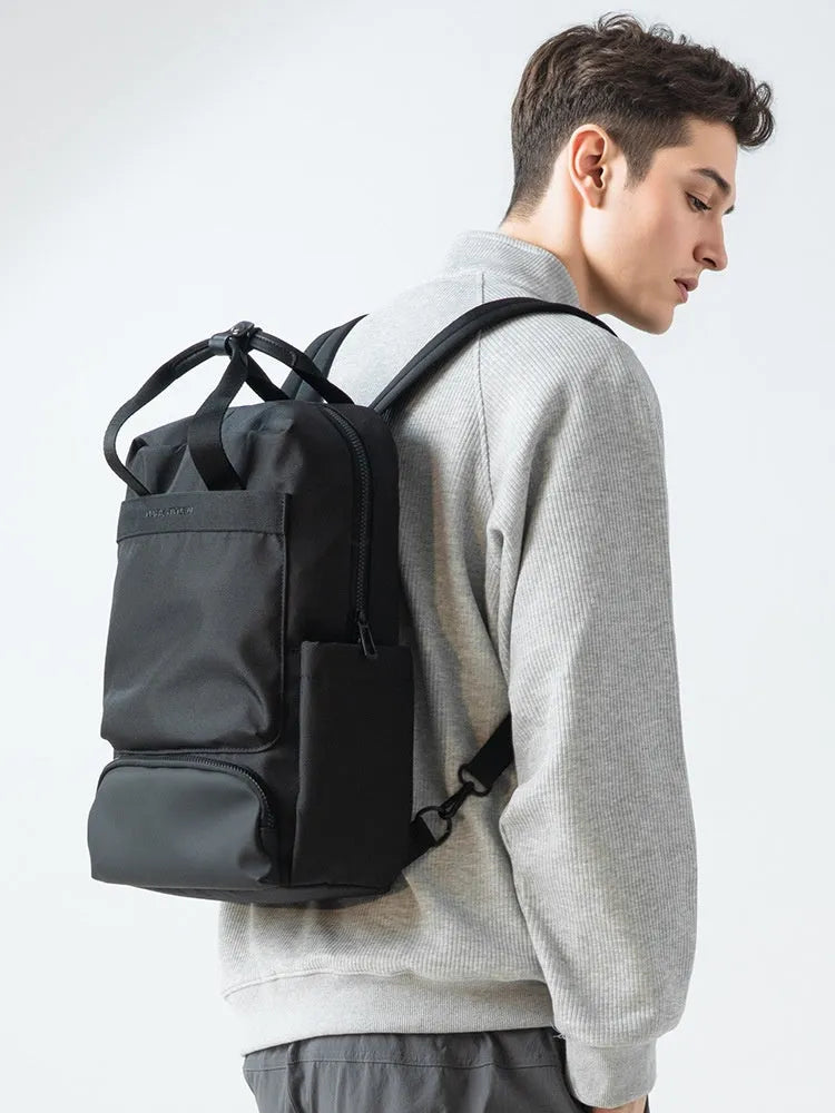 Black Oxford cloth computer backpack with 20-35L capacity showing interior polyester lining