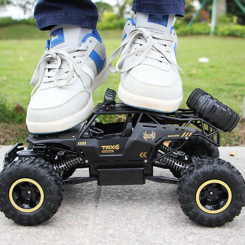 Black and silver 4WD remote control off-road climbing car with 2.4G wireless controller
