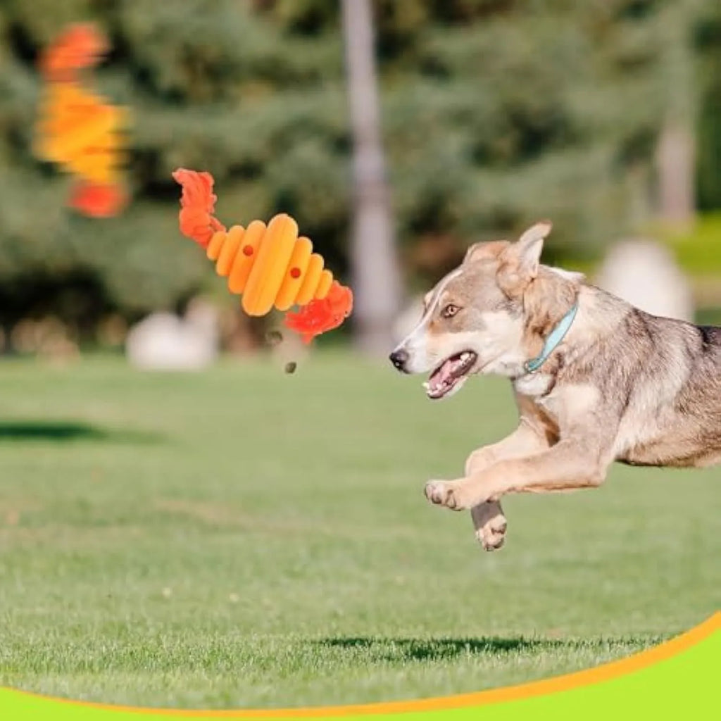 Large green and yellow silicone dog toy with a knotted rope and hollow ball for food dispensing.