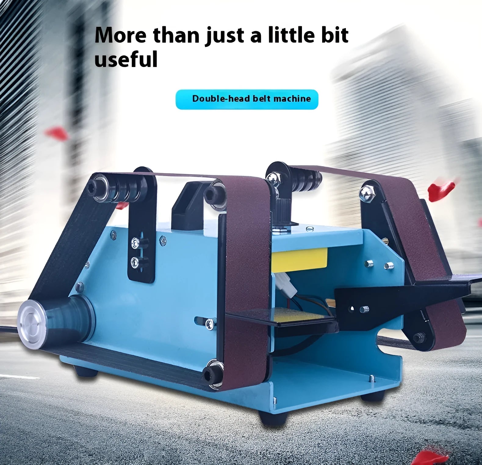 Blue desktop dual-axis belt sander with abrasive belt, shown on a workshop bench.