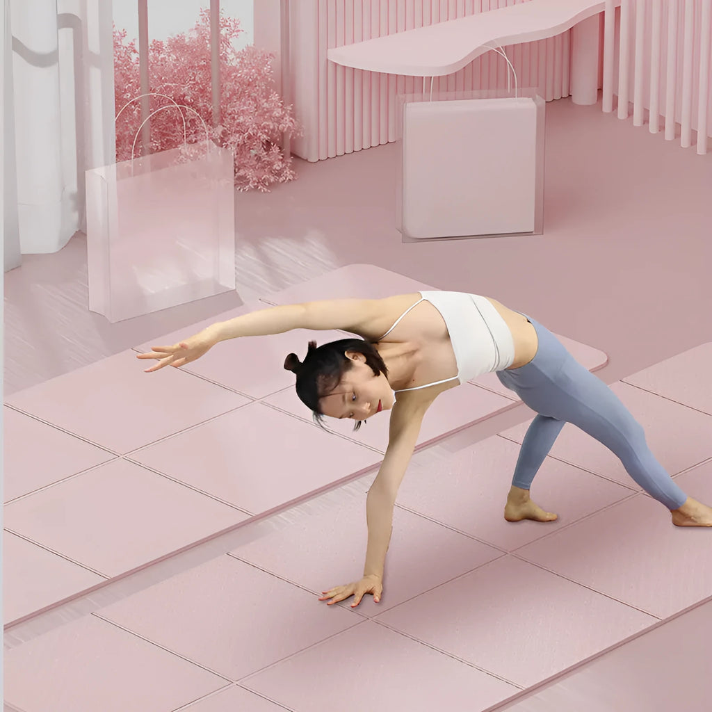Blue TPE folding yoga mat unfolded on a floor, showing its 183cm length and non-slip texture.