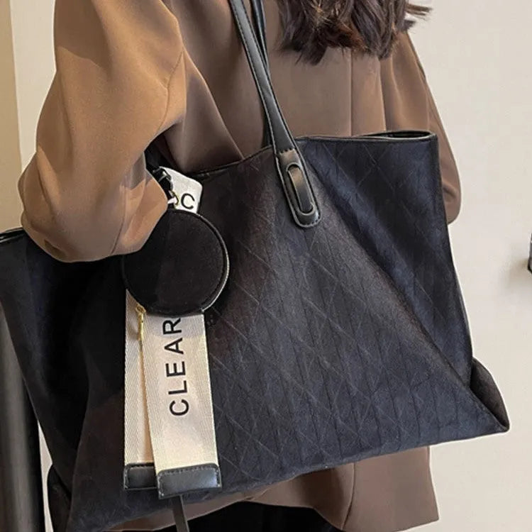 Soft polyester large tote shoulder bag in a horizontal square shape with an external pocket.