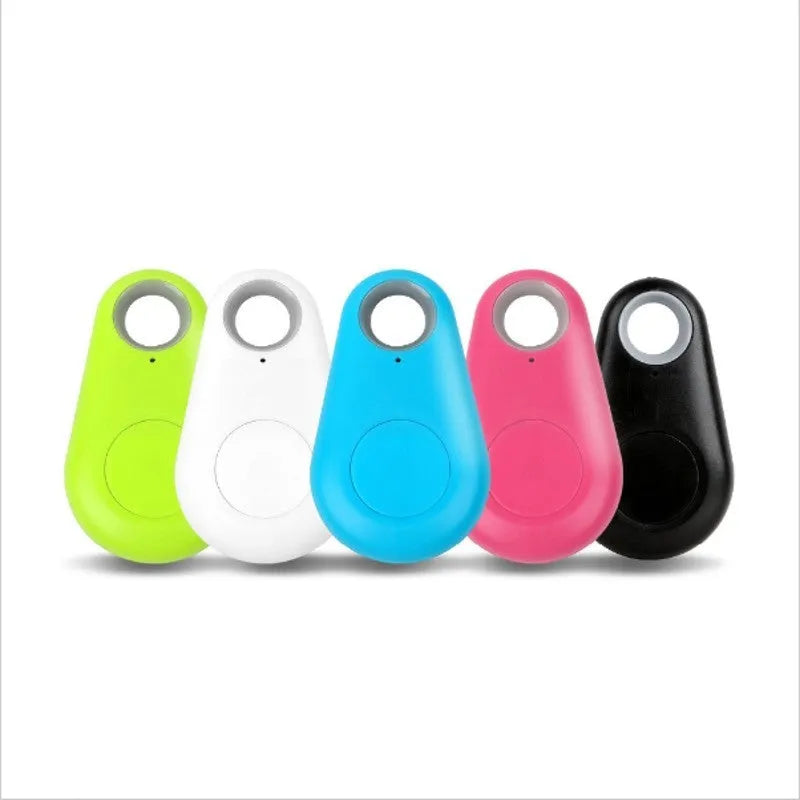 Small black Bluetooth tracker on a keyring with white logo and rounded edges