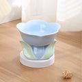Blue ceramic raised pet bowl with floral pattern and non-slip base for cats and small dogs