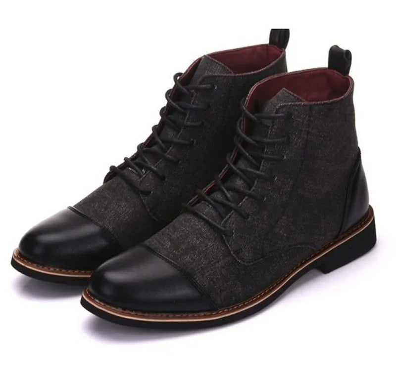 Men's black leather motorcycle boots with metal belt buckle details on a rubber sole.