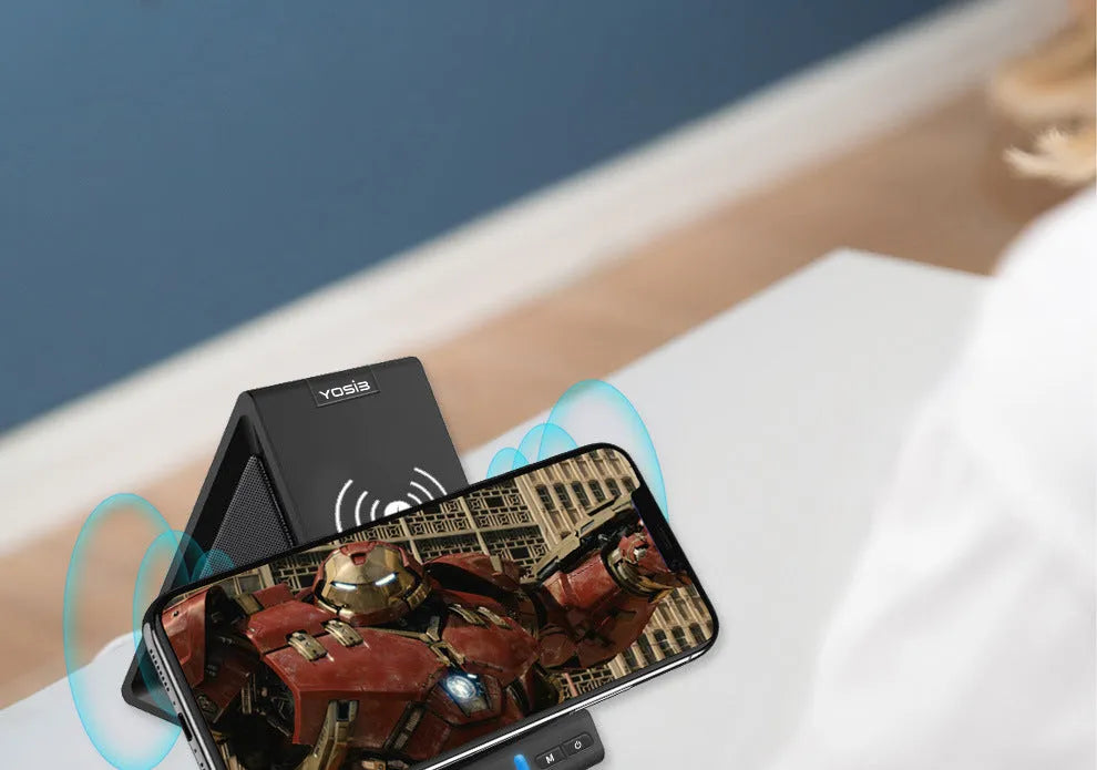Black multifunctional Bluetooth speaker with integrated wireless charger and phone stand