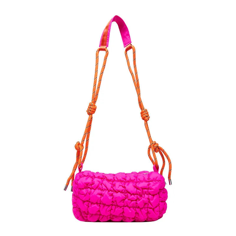 Soft pillow-shaped nylon messenger bag in multiple colours with a single shoulder strap.