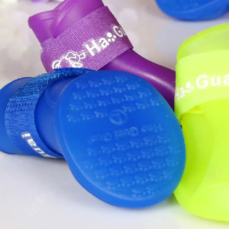 Soft silicone pet rain boots in royal blue and yellow, showing non-slip sole, for dogs size S M L